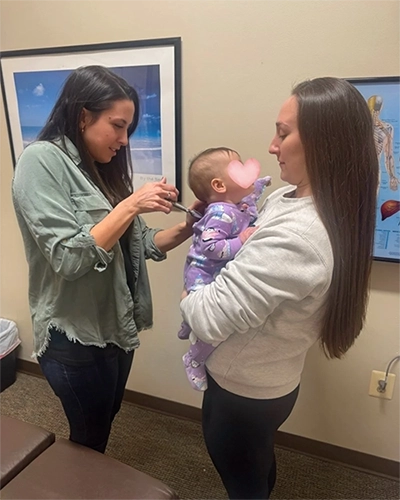 Chiropractor Baltimore MD Erin Becker With Baby